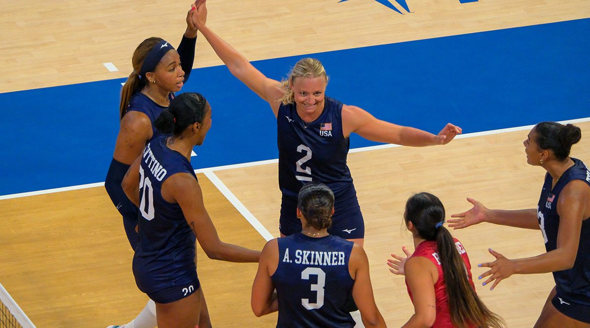 Jordyn Poulter celebrates on the court with her U.S. teammates